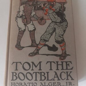 May include: A vintage book cover with a black and white illustration of two baseball players. The book title is "Tom the Bootblack" by Horatio Alger, Jr.