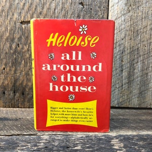 May include: A red book with the title "Heloise all around the house" in yellow lettering with a daisy graphic. The book cover has a tagline that reads "Bigger and better than ever! Here's Heloise, the housewife's favorite helper, with more hints and how-to's for everything - alphabetically arranged to make things even easier."