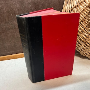 May include: A black and red hardcover book with a spine that says "Guzzin'"