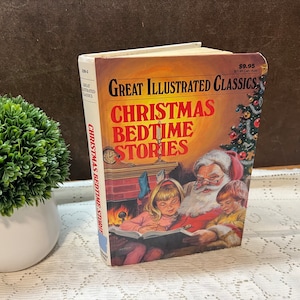 May include: A vintage hardcover book titled "Great Illustrated Classics: Christmas Bedtime Stories". The cover features an illustration of Santa Claus reading a book to two children by a fireplace.