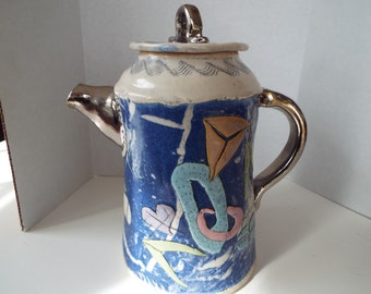 unusual studio pottery art vessel coffee pot pitcher applied clay abstract forms hearts circles design clay teapot blue silver