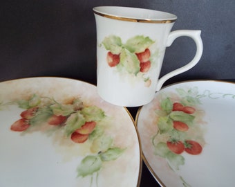 set of 3 hand painted porcelain mug and plates with strawberries gold trim signed Dalenberg a Midwest artist  cabinet plates display dishes