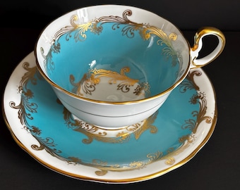 Vintage Aynsley Oban tekopp med bred öppning, turkos med tung guldfiligran och rullar, engelskt benporslin, sällsynt samlarobjekt