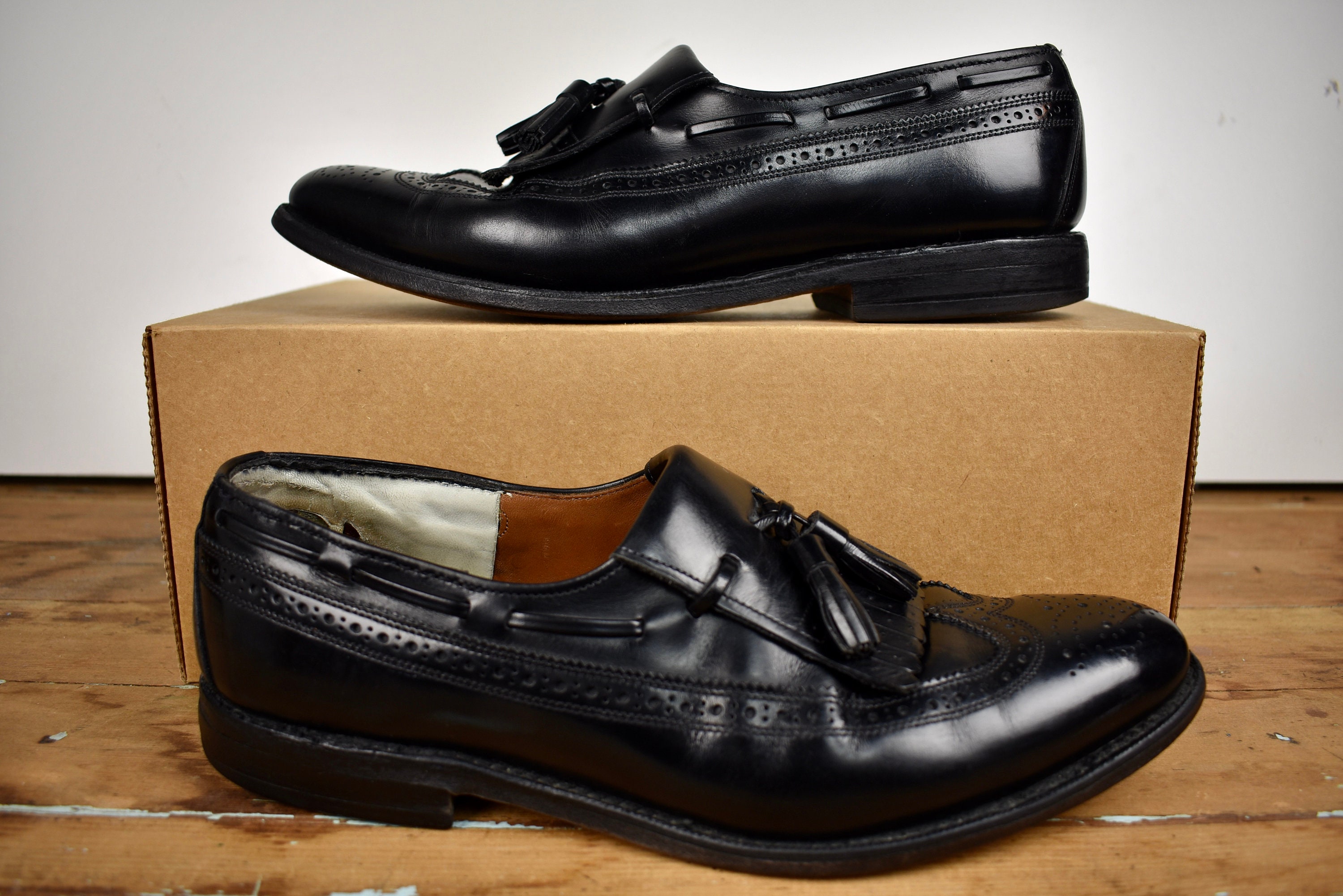 Buy Allen Edmonds Arlington Black Longwing Gunboat Tasseled 