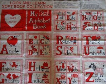 May include: A white fabric panel featuring the Look and Learn Soft Book Collection My Red Alphabet Book. The print displays red letters and illustrations for each letter from A to Z, including an apple, ball, car, dog, ear, fish, galoshes, hat, indian, jail, kite, lion, mice, nest, owl, pizza, queen, robot, slide, truck, umbrella, vase, web, x-ray, yak, and zebra.