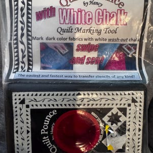 May include: A black Quilt Pounce tool with white chalk, designed for quilt marking. The packaging features text that reads "Quilt Pounce by Hancy" and "White Chalk Quilt Marking Tool." It includes instructions to "swipe and sew!" for stencil transfer.