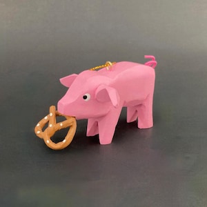 Oktoberfest Pig eating a Pretzel