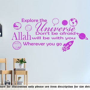 May include: Pink vinyl wall decal with the text "Explore the Universe Don't be afraid Allah will be with you Wherever you go" and illustrations of planets and a rocket ship.
