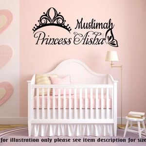 May include: A pink nursery with a white crib and a wall decal that says "Muslimah Princess Aisha" with a crown and butterfly design.