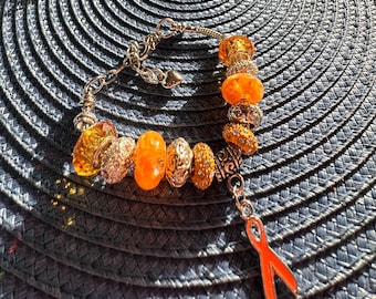 Pulseira de contas M.S. Awareness: fita laranja claro, ajustável