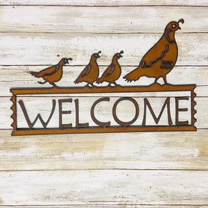 Quail welcome sign made out of rusted recycled metal