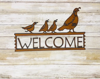 Quail welcome sign made out of rusted recycled metal