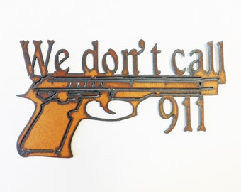 We Dont Call 911 sign made out of rusted metal