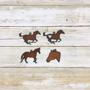 Horse-themed rodeo western  equestrian charms made of rusted metal made in the USA