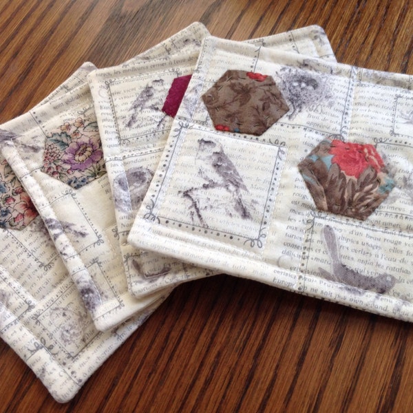 A Set of 4 Coasters of Bird Stamp Print Fabric, Designed with Hand Quilted Hexies