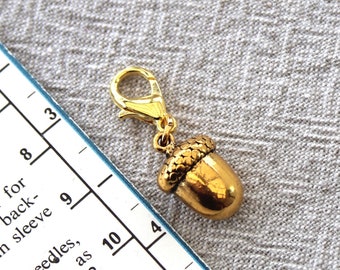 Gold Acorn Progress Keeper for knitting & crochet. Use as a progress marker or removable stitch marker directly on the yarn.