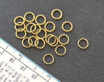 20 gold tone REGULAR ROPE Knitting Stitch Markers. Stitch markers with a twist! Fits 4.5mm (US7) knitting needle.