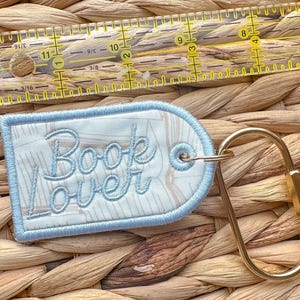 Book Lover Embroidered Keychain, Bookish Bag Charm, Embroidered Bag Tag, Bookworm Gift, Reader Gift, Book Club Gift, Oval Carabiner Clip