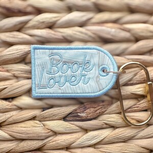 Book Lover Embroidered Keychain, Bookish Bag Charm, Embroidered Bag Tag, Bookworm Gift, Reader Gift, Book Club Gift, Oval Carabiner Clip