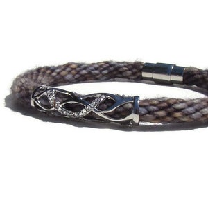 Woven kumihimo bracelet / anklet in variegated blue and brown hand dyed specialty yarn with rhinestone charm and SS magnetic clasp