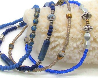 Set of 4 stackable, stretch bracelets with Sodalite stones and seed beads in blues and gold