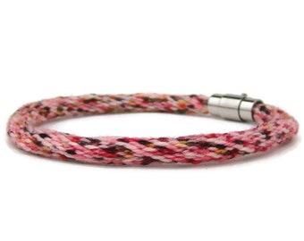 Woven kumihimo bracelet / anklet, with hand dyed variegated pink specialty yarn and stainless steel magnetic clasp