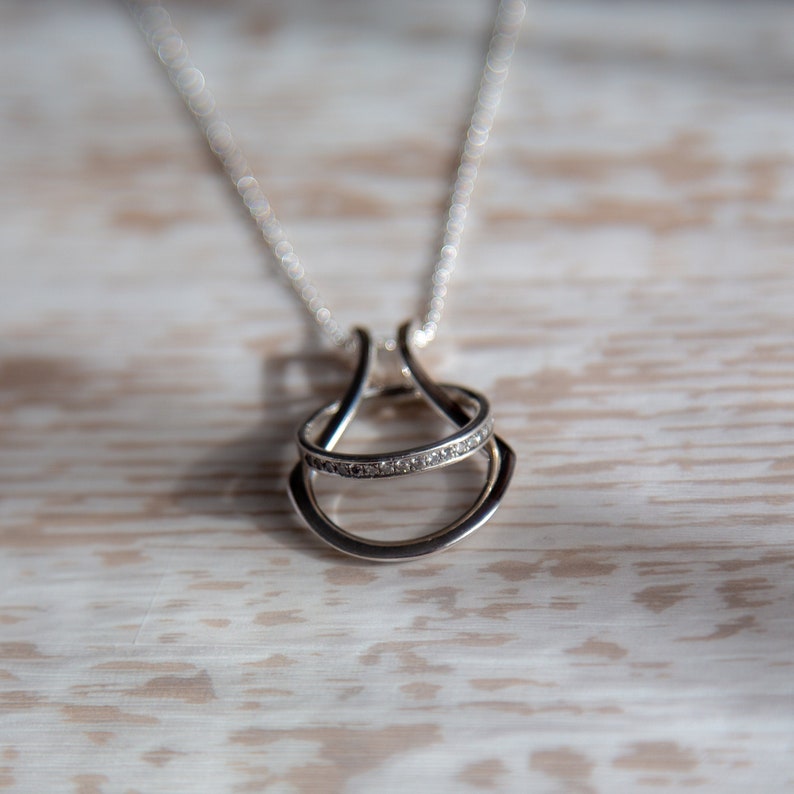 A beautiful Horseshoe Ring Holder Pendant Necklace in available Sterling Silver, 18K Yellow and Rose Gold Vermeil. This ring keeper is available a variety of lengths.