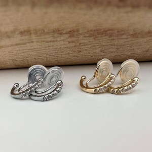 PAINLESS! U-shaped spiral clip-on earrings with half-circle and mini round zircon stones, gold plated. Comfortable ear clips.