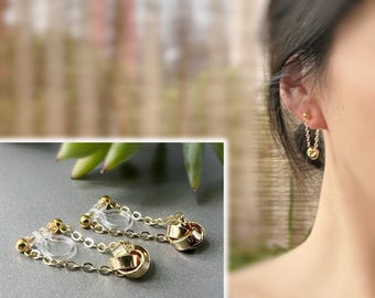 Invisible clip-on earrings with a gold-plated chain and a small four-petaled flower. Clip-on earrings for non-pierced ears.