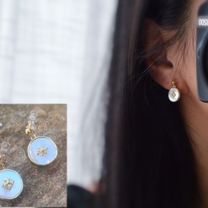 INVISIBLE Clip-on earrings. Small white mother-of-pearl shell disc. Mini golden flower. Minimalist Jewelry. Delicate earrings.
