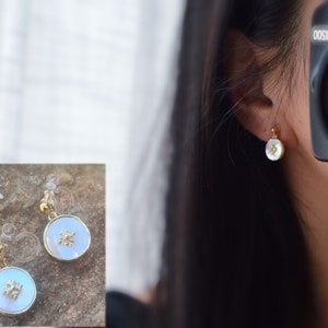 Invisible clip-on earrings. Small mother-of-pearl disc, white shell, mini gold flower. Minimalist jewelry. Delicate earrings.
