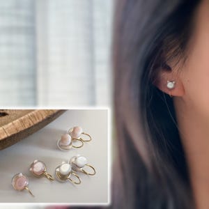 PAINLESS! Clip-on earrings with a spiral design featuring a small cat&#39;s head. Hand-carved natural seashells. Comfortable ear clips.