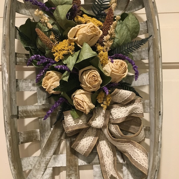 White-washed tobacco basket with dried flower bouquet