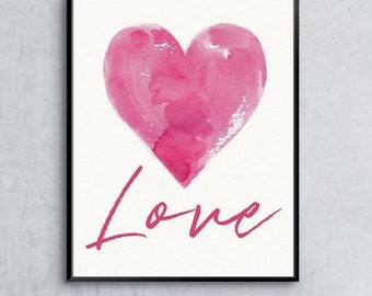 May include: A watercolor painting of a pink heart with the word "Love" written in pink script below it.