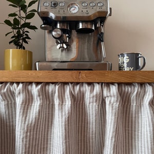 vanity curtain covers space in kitchen