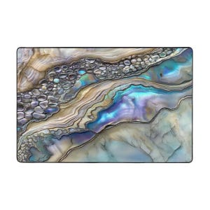 May include: Abstract art print featuring a swirling pattern of iridescent blue, purple, and gold colors. The pattern resembles a close-up of a seashell or a rock formation.