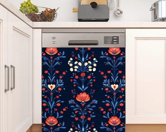 May include: A dishwasher with a decorative floral design. The design features red and white flowers with blue leaves on a dark blue background. The dishwasher is in a white kitchen.