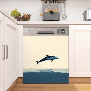 May include: A dishwasher with a decal of a dolphin jumping out of the water. The decal is in shades of blue and white on a cream background.