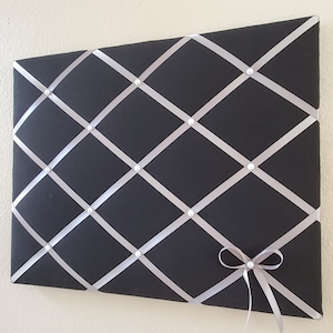 Black and gray fabric memo, photo, vision board