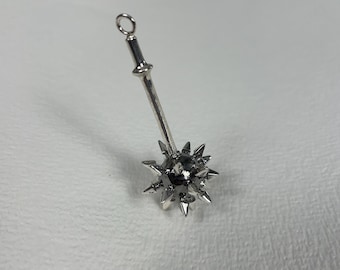 May include: A silver-colored metal pendant in the shape of a spiked ball on a chain. The ball has many sharp points.