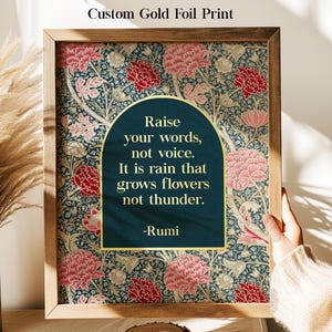 May include: A framed gold foil print with a floral pattern in red, pink, and gold on a dark teal background. The print features a quote by Rumi in a gold arched frame. The words "Custom Gold Foil Print" are at the top.
