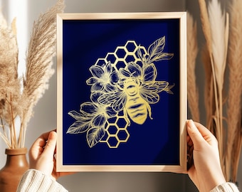 May include: Gold foil print of a bee and honeycomb on a deep navy blue background. The print is 8.5x11 inches and the framing is not included.