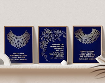 May include: Three framed prints with gold foil designs and quotes by Ruth Bader Ginsburg on a deep navy blue background. The quotes are "Speak your mind even if your voice shakes", "Fight for the things that you care about, but do it in a way that will lead others to join you", and "Women belong in all places where decisions are being made".