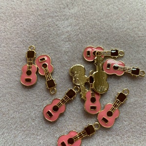 Pink guitar charms