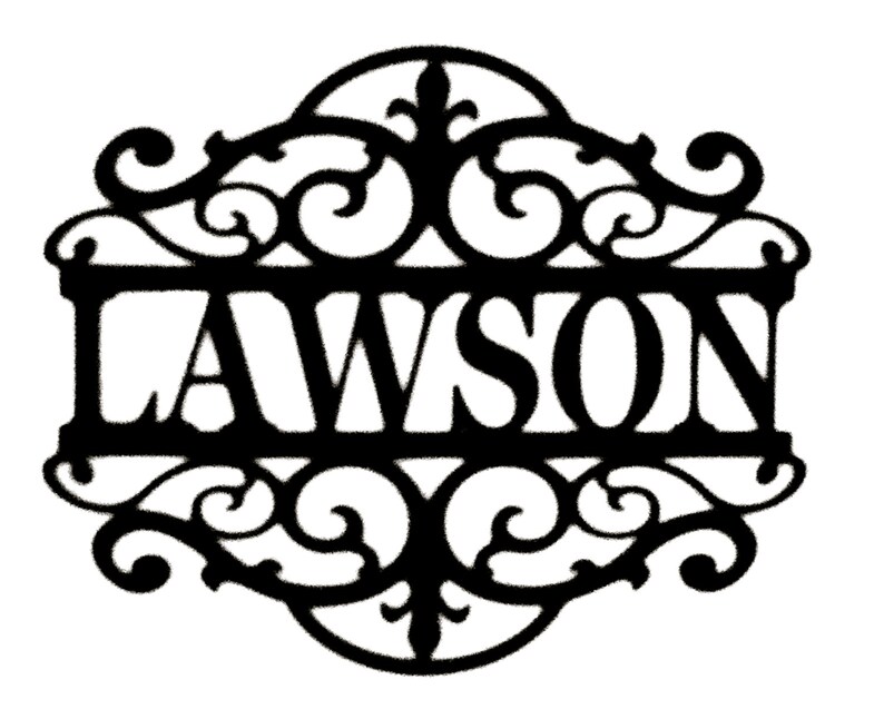 May include: Black metal sign with the name "LAWSON" in bold, capital letters. The name is centered within an ornate, decorative frame with scrolling flourishes and floral accents, suitable for home decor.