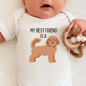 May include: White baby onesie with the text "My best friend is a" and a cartoon image of a brown doodle dog.