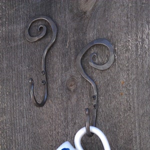 Two hand forged hooks
