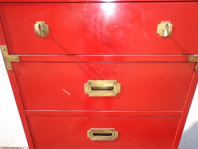 red campaign dresser How To Style A Red Lacquer Campaign Dresser