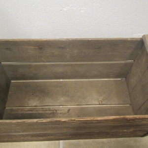 Old rustic weathered wood crate. Has some cracks, rotting wood . very old rough condition.  Handle holes in ends . *** Free Shipping ***