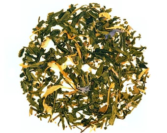 May include: A close-up of a blend of green tea leaves, yellow flower petals, and blue flower petals.